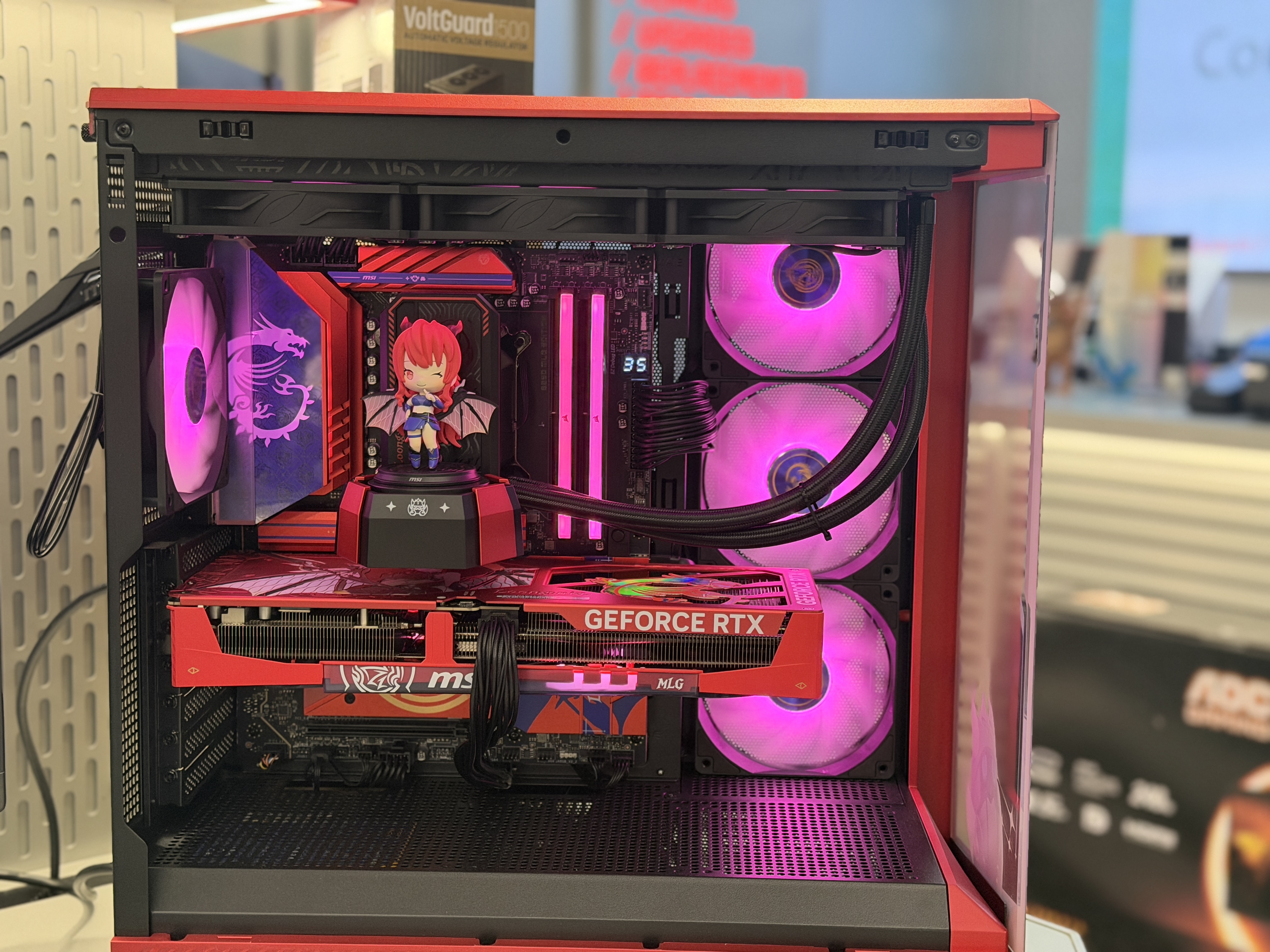 Interior of a custom gaming PC showing clean cable management and RGB cooling fans
